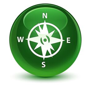 green circle icon with compass